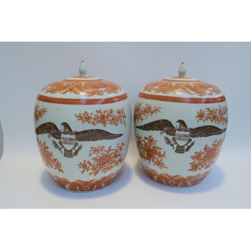 7797 - A pair of large ceramic lidded pots / containers with eagle armorial crests, floral detail, 34cm tal... 