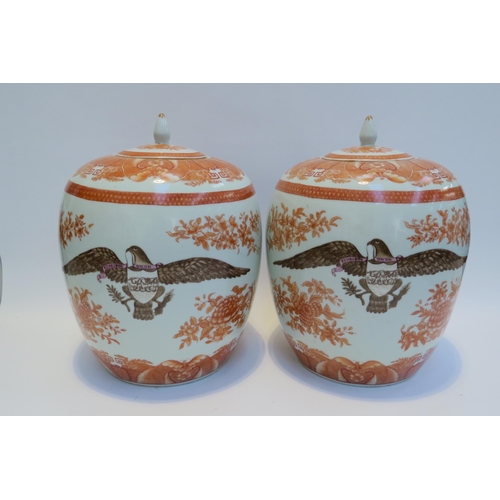 7797 - A pair of large ceramic lidded pots / containers with eagle armorial crests, floral detail, 34cm tal... 