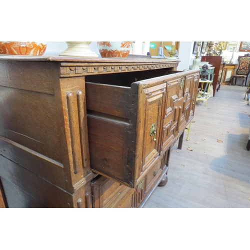 7799 - A 17th Century Jacobean oak chest of three deep long drawers, geometric mouldings, on bun feet, 96cm... 