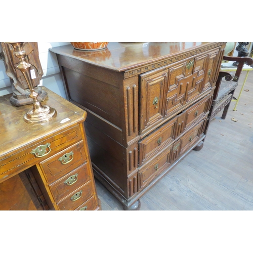 7799 - A 17th Century Jacobean oak chest of three deep long drawers, geometric mouldings, on bun feet, 96cm... 