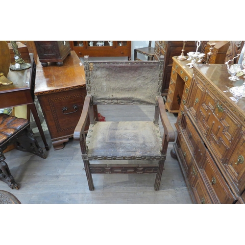 7800 - A late 17th/early 18th Century Spanish walnut armchair with embossed leather back and seat (distress... 