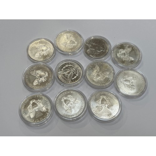 7252 - Nine 1oz fine silver American one dollar coins including 2013 Eagle