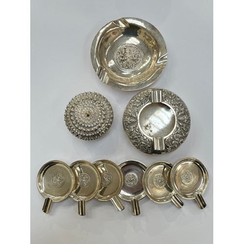 7254 - A Sterling silver ashtray, six Siam silver small ashtrays, a Thai Sterling silver ashtray and Orient... 