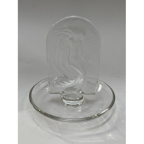 7263 - A Lalique Glass dressing table ring dish with upright panel of 'Naide' design with nude female, 10cm... 