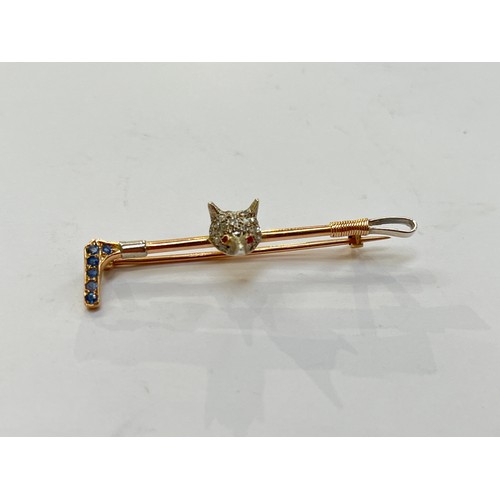 7273 - A stock pin with a diamond encrusted fox head on a riding whip with sapphire studded handle, 4.4g