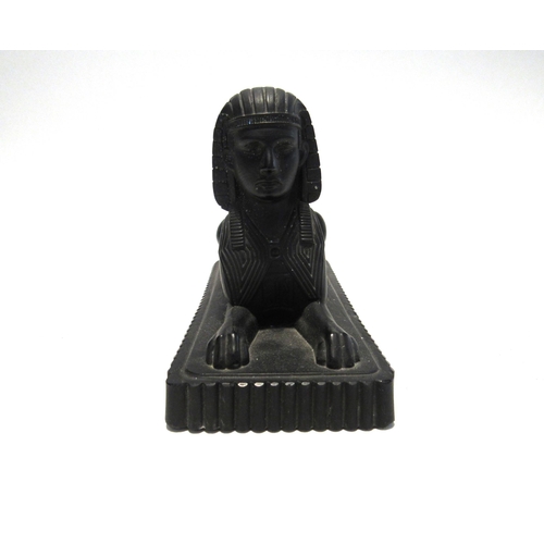 7126 - A Victorian slag glass obelisk, 28cm tall and Victorian moulded glass Sphinx with lozenge mark to ba... 