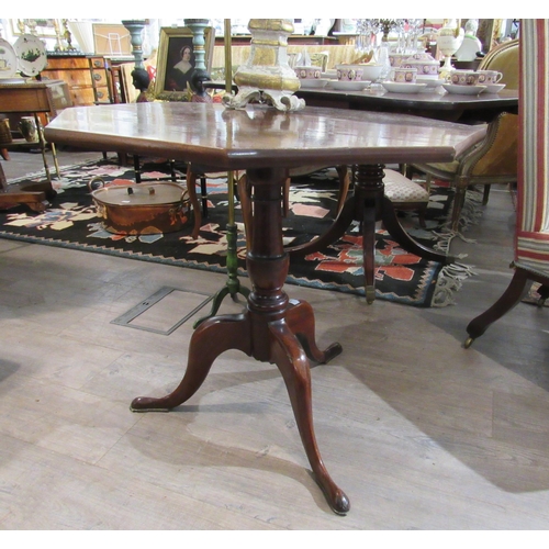 7136 - A George III mahogany octagonal tilt top tripod table, 71cm tall, 76cm diameter top