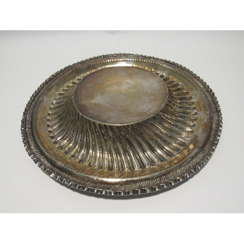 7148 - WITHDRAWN: London Assay office stamped foreign silver embossed charger/alms dish with family crest d... 