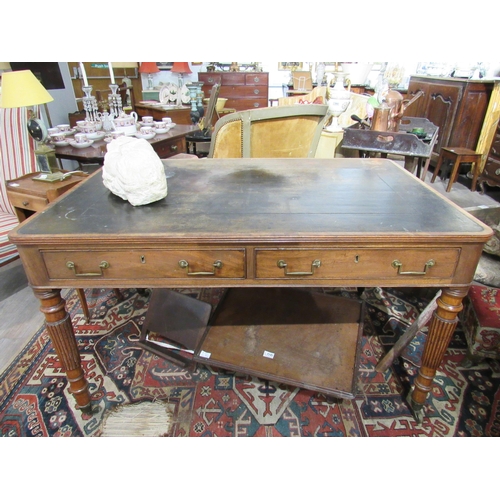 7150 - A George III library desk with inset tooled leather top with Greek key border.  Reeded edge over two... 