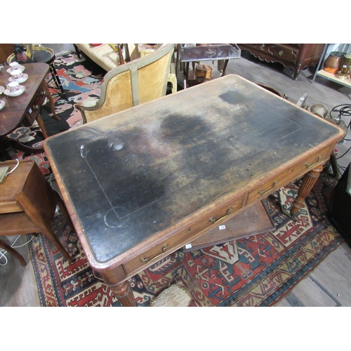 7150 - A George III library desk with inset tooled leather top with Greek key border.  Reeded edge over two... 