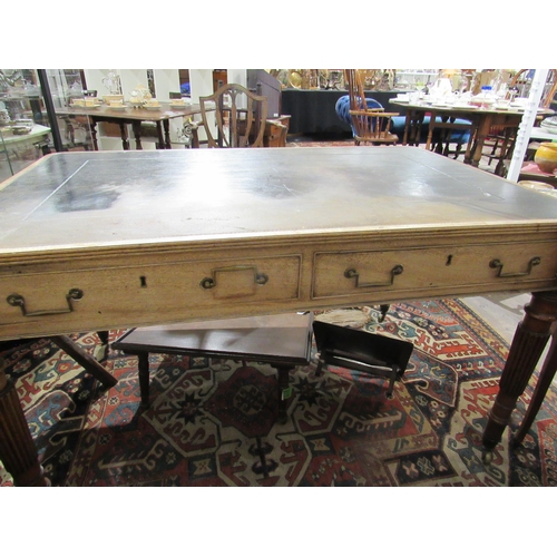 7150 - A George III library desk with inset tooled leather top with Greek key border.  Reeded edge over two... 