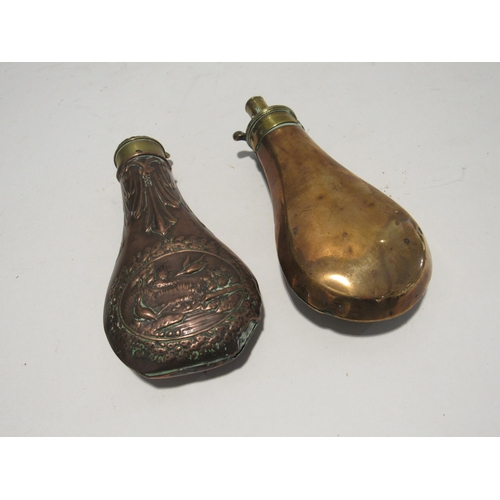 7160 - Two 19th Century copper and brass shot/powder flasks one with embossed design of flying birds, 19cm ... 