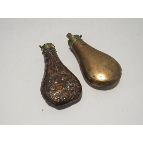 7160 - Two 19th Century copper and brass shot/powder flasks one with embossed design of flying birds, 19cm ... 