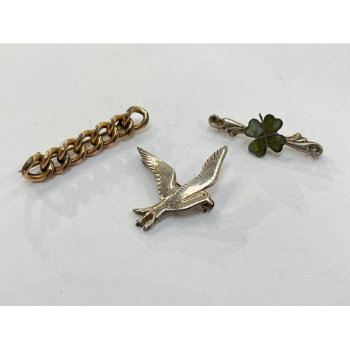 7296 - A silver dove brooch, silver four leaf clover brooch and pinchbeck brooch (3)