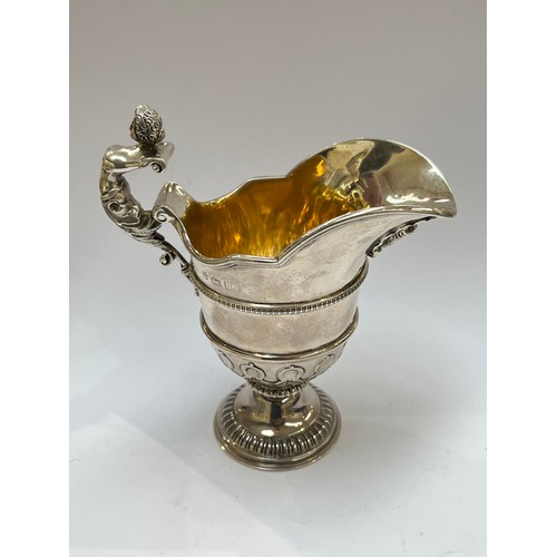 7299 - An Alexander Clark silver cream jug, Birmingham 1912, marks rubbed, 13cm tall, 194g