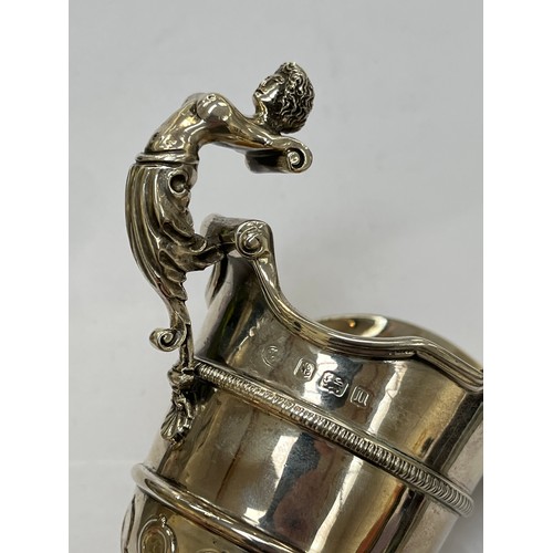 7299 - An Alexander Clark silver cream jug, Birmingham 1912, marks rubbed, 13cm tall, 194g