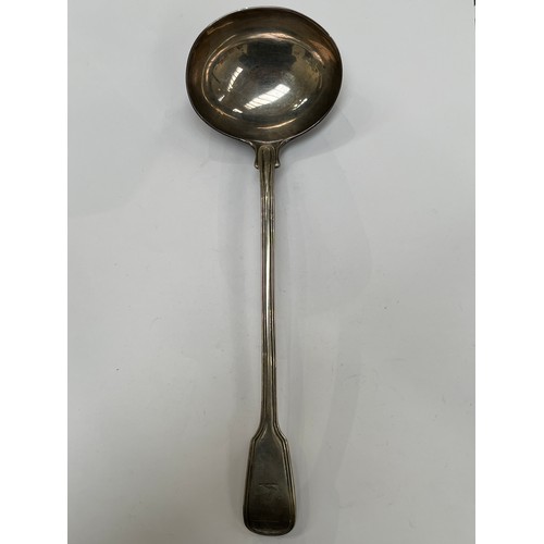 7304 - A Chawner & Co (George William Adams) silver soup ladle, reeded detail, emblem of arm holding a dagg... 