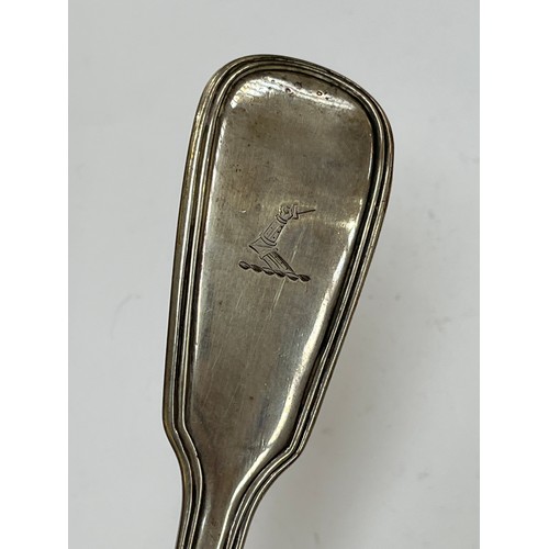 7304 - A Chawner & Co (George William Adams) silver soup ladle, reeded detail, emblem of arm holding a dagg... 