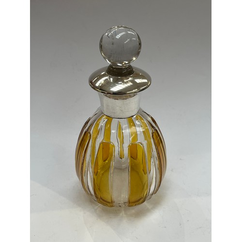 7311 - An amber and clear glass scent bottle with sterling silver collar, glass stopper, 11cm tall