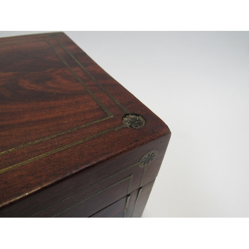 7801 - A George III mahogany rectangular tea caddy inset with brass. Raised on bun feet with associated mix... 