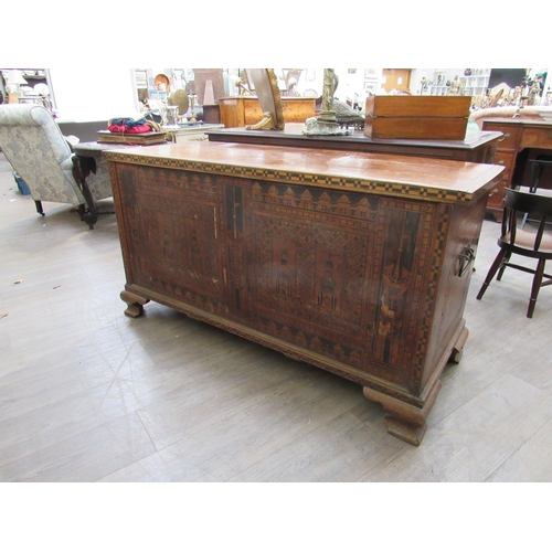 7802 - A 19th Century marquetry and parquetry inlaid chest, the front with minarets and architectural panel... 