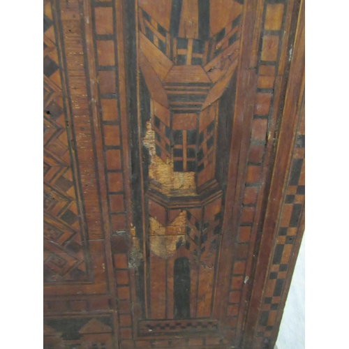 7802 - A 19th Century marquetry and parquetry inlaid chest, the front with minarets and architectural panel... 