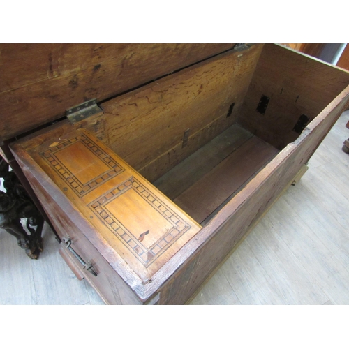 7802 - A 19th Century marquetry and parquetry inlaid chest, the front with minarets and architectural panel... 