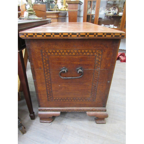 7802 - A 19th Century marquetry and parquetry inlaid chest, the front with minarets and architectural panel... 