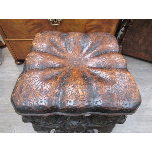 7804 - A 19th Century walnut stool carved with lions