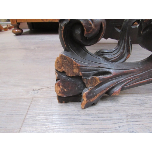 7804 - A 19th Century walnut stool carved with lions