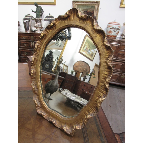 7805 - A gilt gesso free-standing table top mirror, 45cm x 35cm