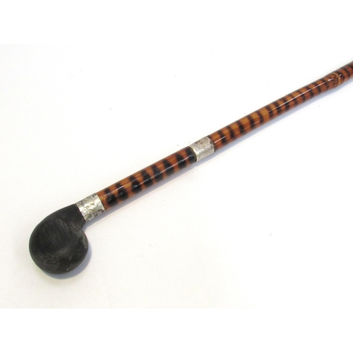 7809 - An early 20th Century bamboo encased sword stick with ebonised handle, total length 87cm