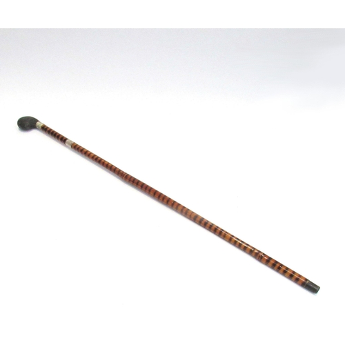 7809 - An early 20th Century bamboo encased sword stick with ebonised handle, total length 87cm