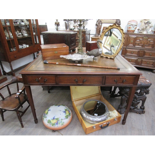 7809A - A George III revival mahogany library desk, the green tooled leather writing insert over three friez... 