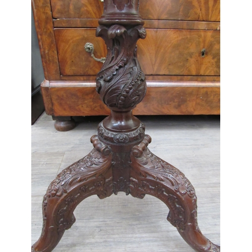 7820 - A pie crust table with elaborate carved decoration on claw and ball feet, (top a/f), 64cm tall, 51cm... 