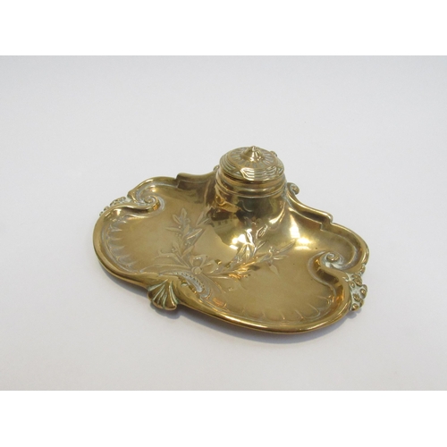 7825 - A Victorian brass inkwell with pen tray