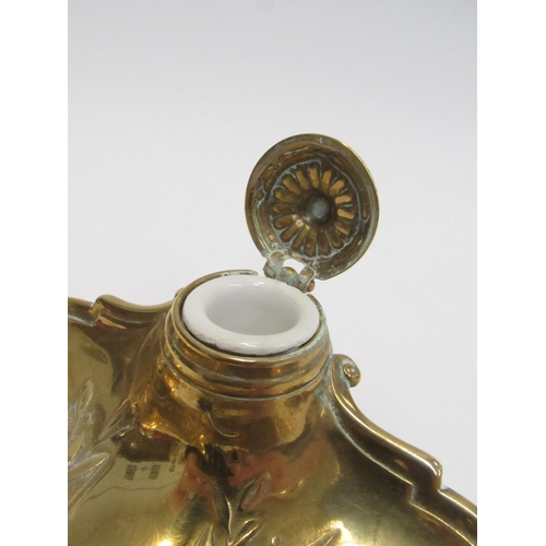 7825 - A Victorian brass inkwell with pen tray