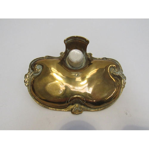 7825 - A Victorian brass inkwell with pen tray