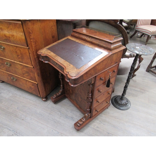 7826 - Circa 1860.  An inlaid burr walnut Davenport with birds eye maple interior, the pierced brass galler... 