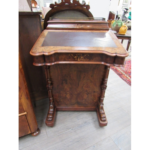 7826 - Circa 1860.  An inlaid burr walnut Davenport with birds eye maple interior, the pierced brass galler... 