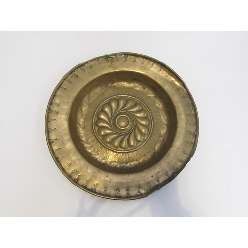 7832 - A 17th Century brass alms dish, some damage present, 39.5cm diameter