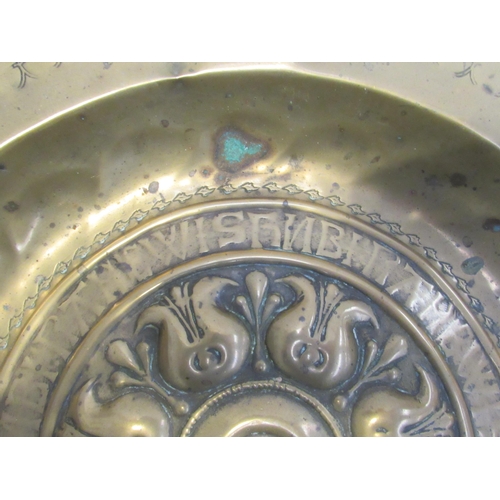 7833 - A 17th Century brass alms dish, some damage present, 41cm diameter