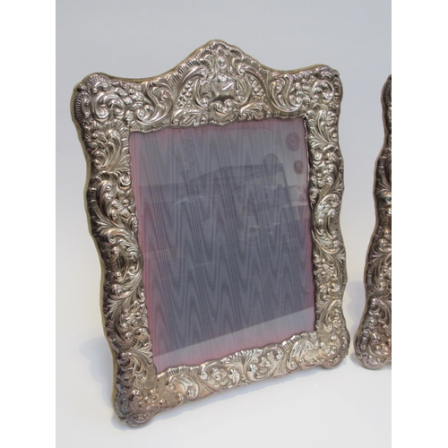 7842A - A pair of Sheffield silver plate easel back photograph frames, foliate scrolled design, overall 38cm... 