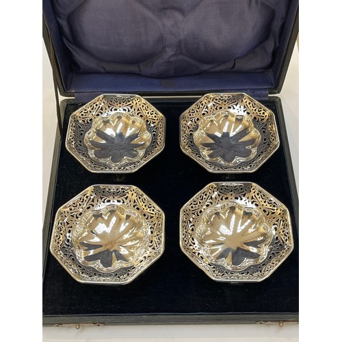 7319 - A Carrington and Co. of Birmingham silver set of four bon-bon dishes of octagonal form, pierced surr... 