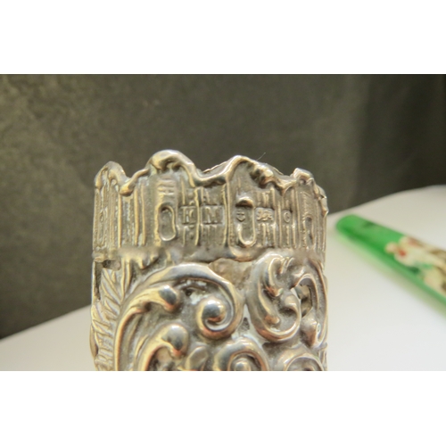 7378 - A Henry Matthews silver scent bottle cover with embossed and pierced scroll decoration, Birmingham 1... 