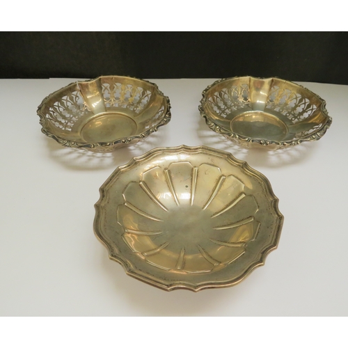 7380 - A pair of silver pierced bonbon dishes by Henry Marshall & Sons Birmingham, 11cm diameter and pedest... 