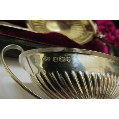 7396 - An Atkin Brothers silver four piece salt set of boat form, Sheffield 1895 with a set of four Francis... 