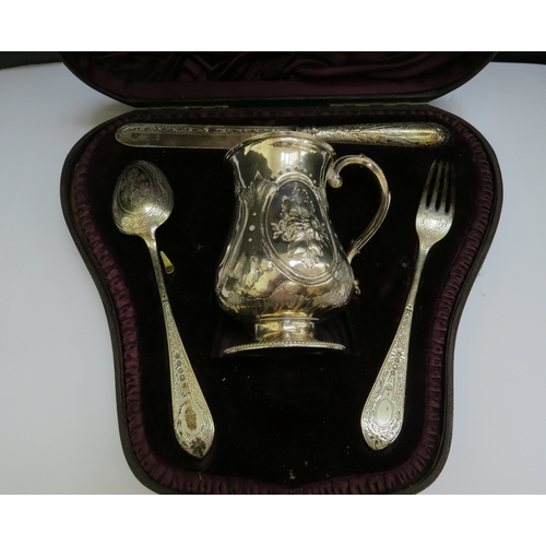 7400 - A Victorian Christening set consisting of tankard by Augustus George Piesse London 1863. Knife, fork... 