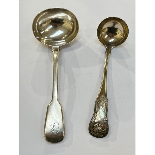 7327 - A Robert Rutland silver sauce ladle, London 1826, together with a J.W. Howden & Co. silver sauce lad... 