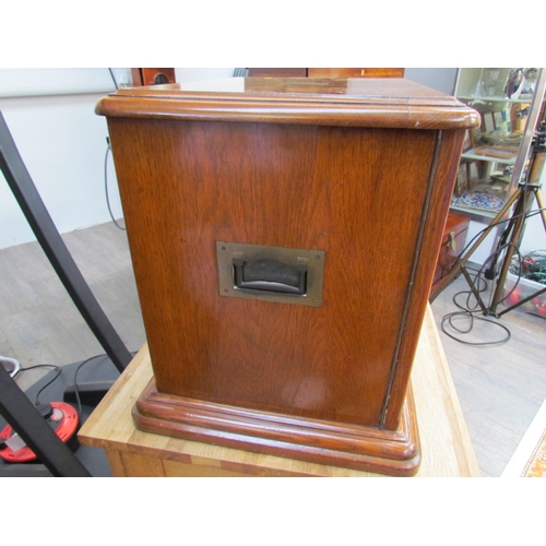 7508 - An early 20th Century honey oak collector’s chest / cutlery canteen, the twin panelled doors opening... 